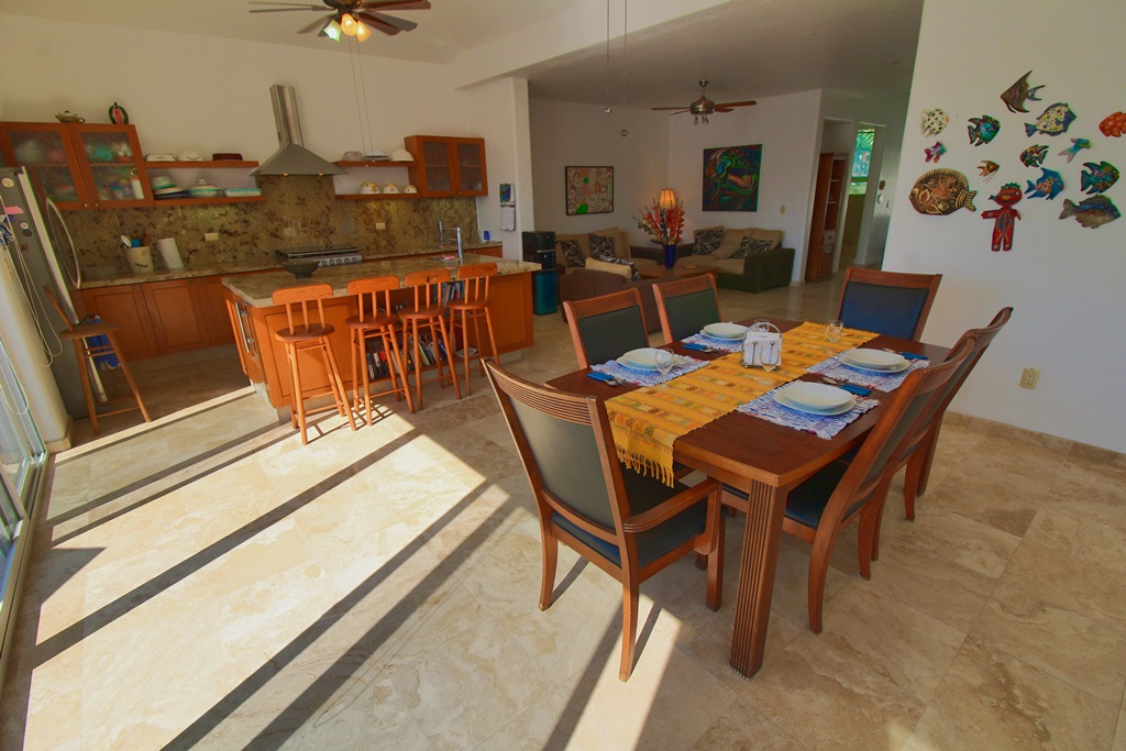 Large dining table for 6 or 8 people, in dining area, kitchen, breakfast area.